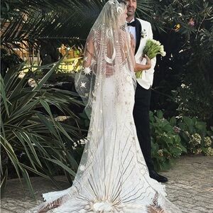 Elegant White Wedding Dress with Celestial Design